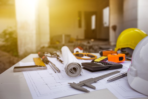 CAD drawing on a work table at a construction site. 