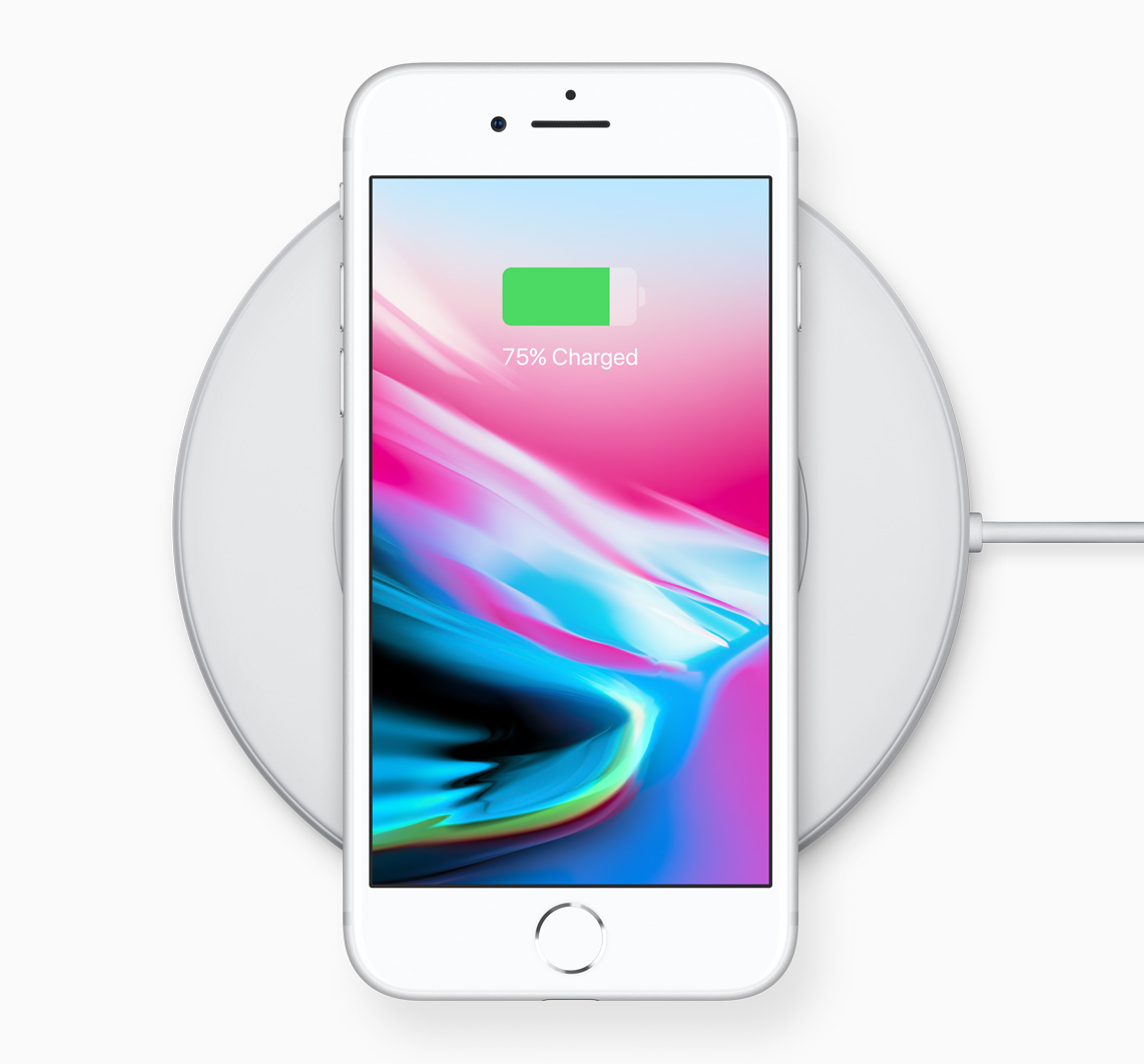 The iPhone 8 positioned on a charging pad.