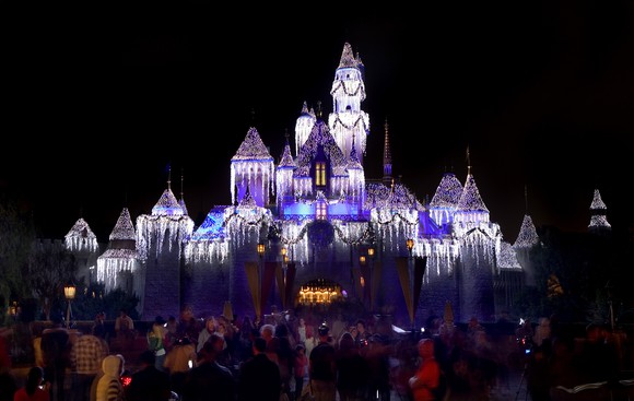 Disneyland's Sleeping Beauty Castle lit up at night.