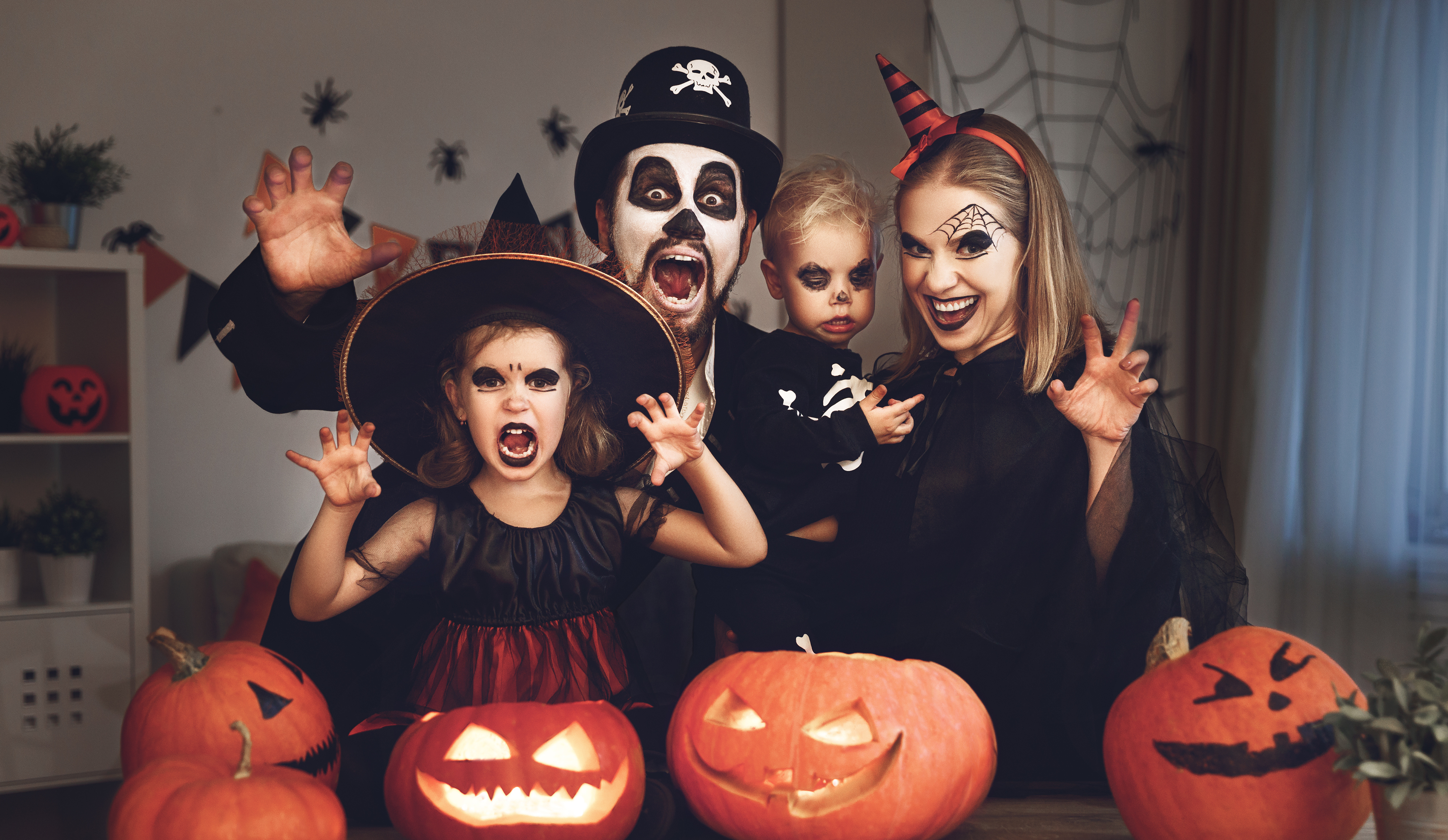 A family of four dressed up in scary Halloween costumes