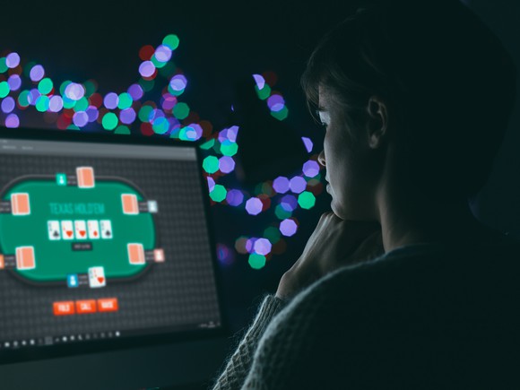 Person playing poker online. 