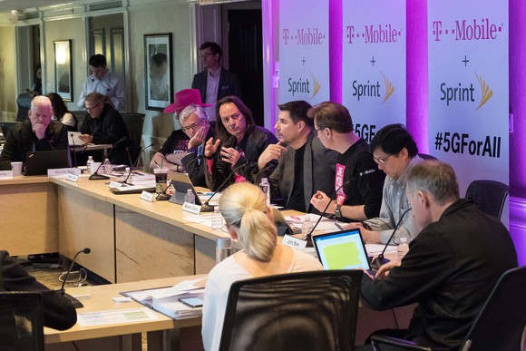 T-Mobile and Sprint executives sitting around a table