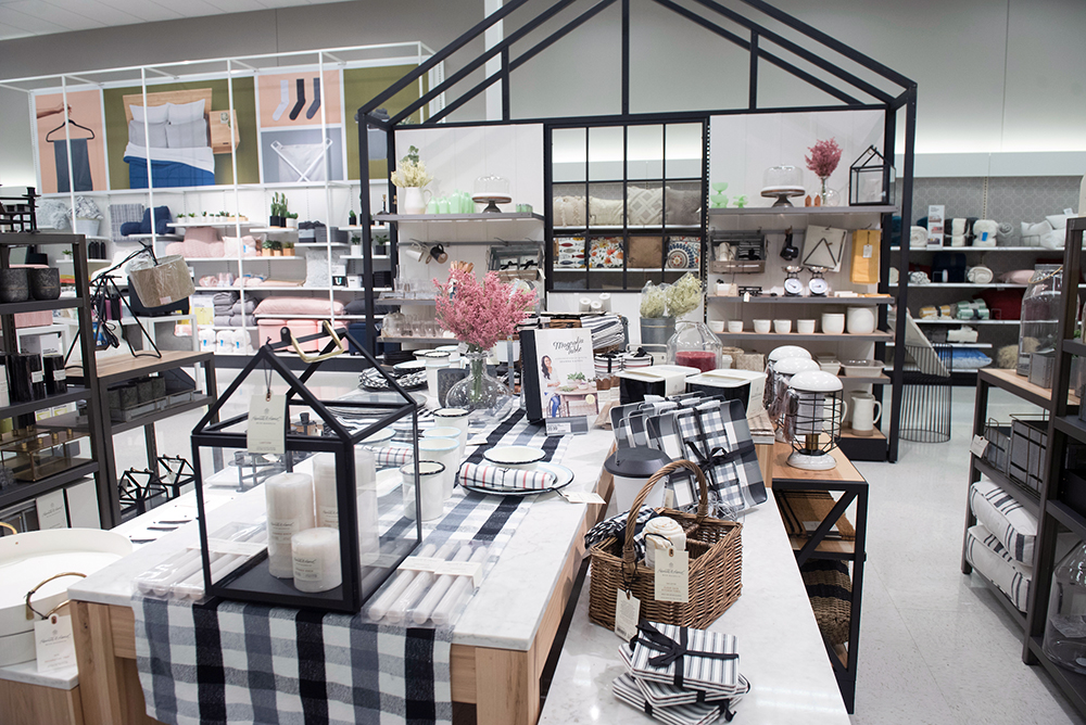 The home section of Target including tables with tablecloths and other home accessories.