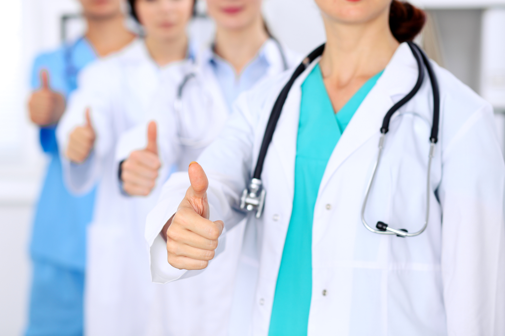 Doctors giving thumbs up