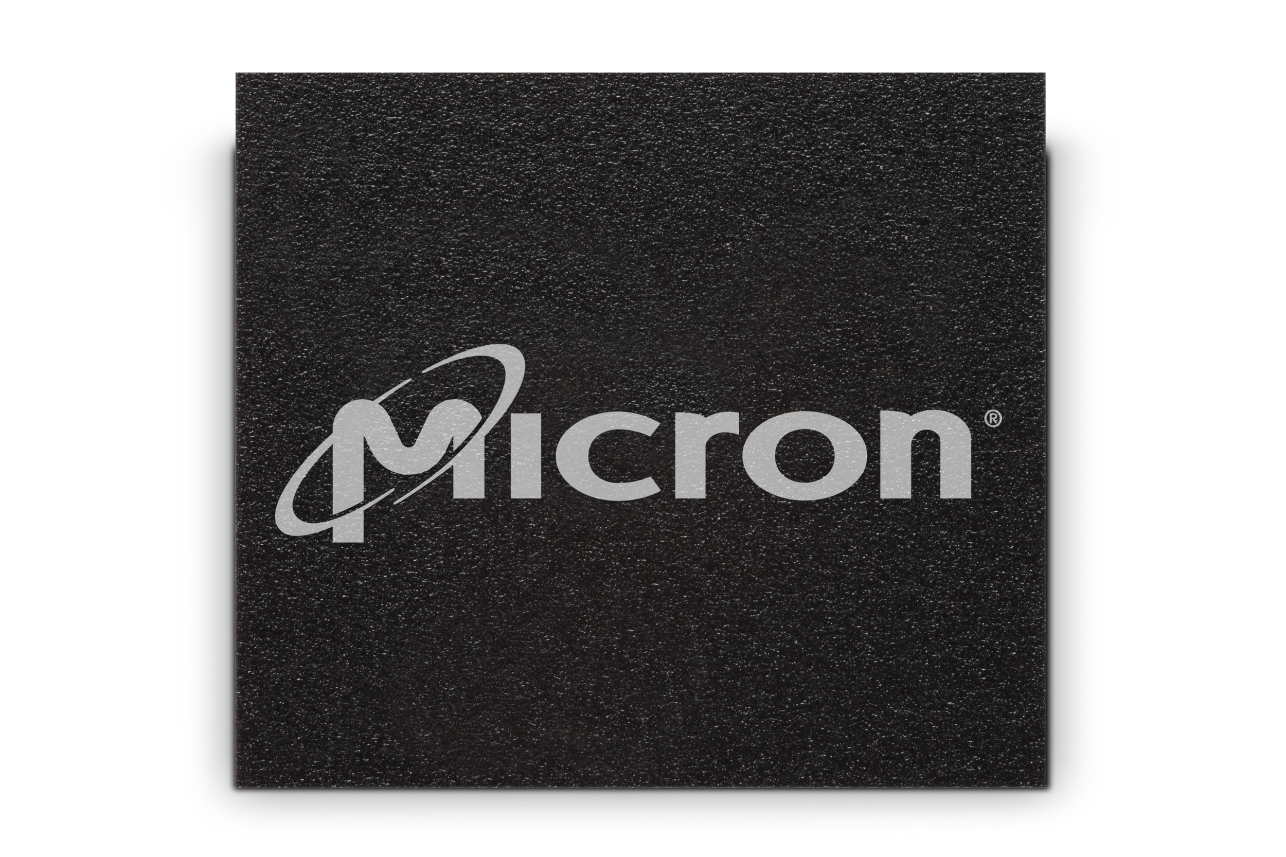 An NAND computer chip with the Micron logo across the front.