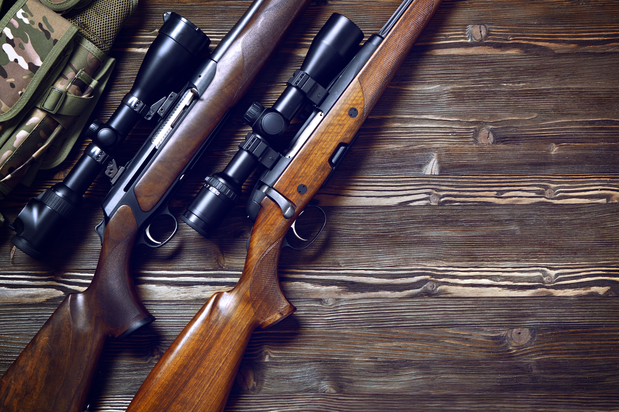 Rifles On a Wood Table