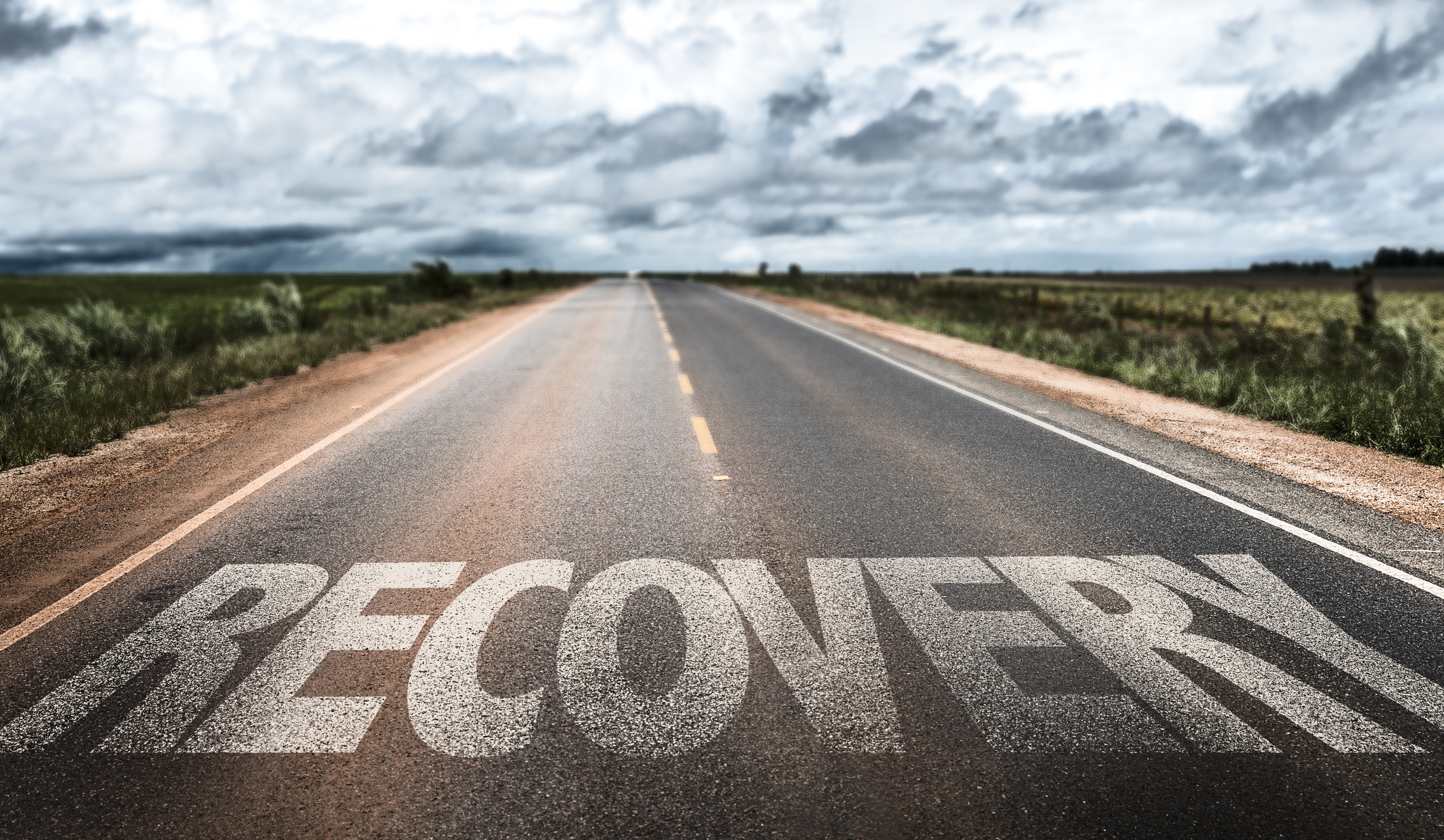 An open road with the word Recovery written across it.