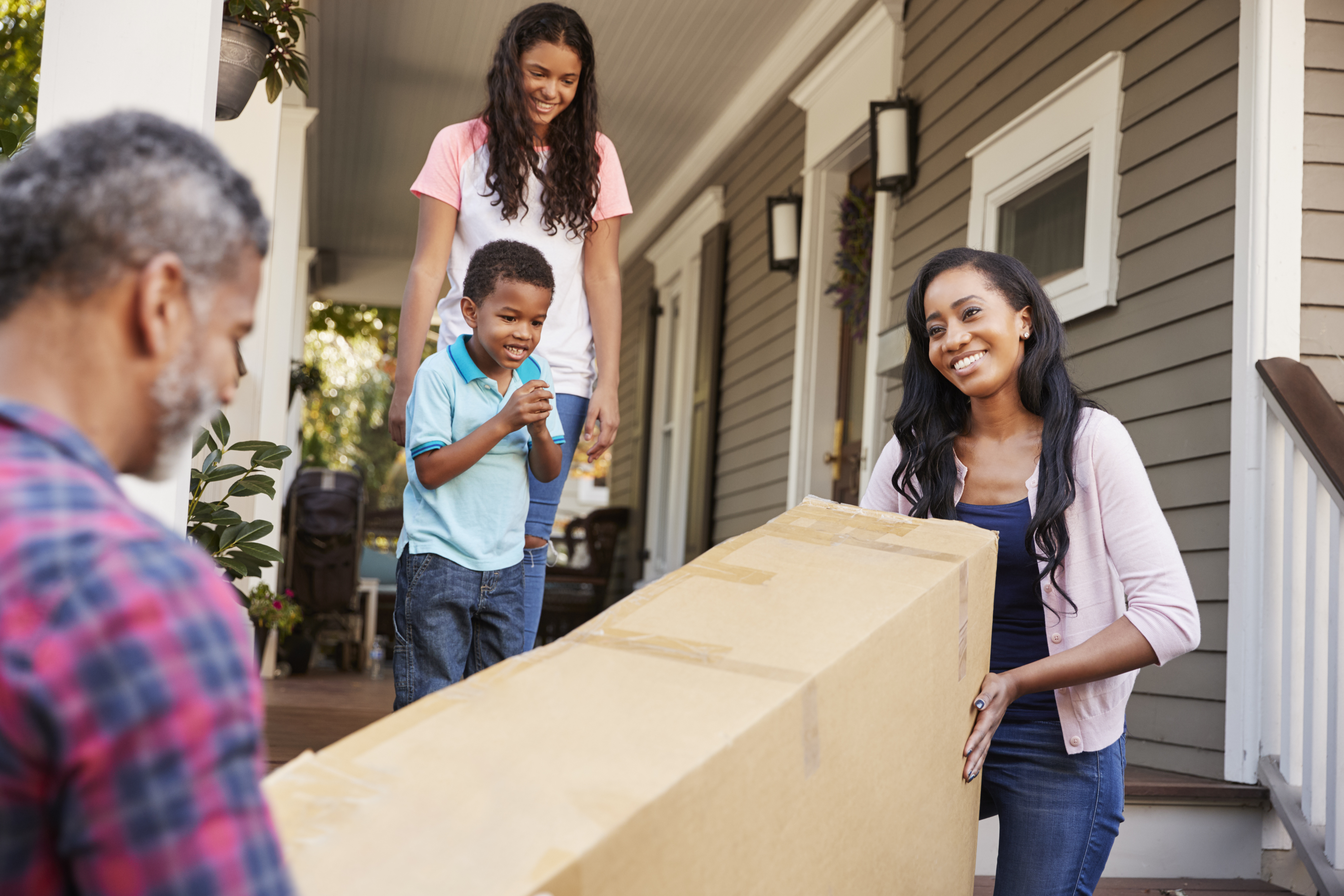a family of four moves into a new home
