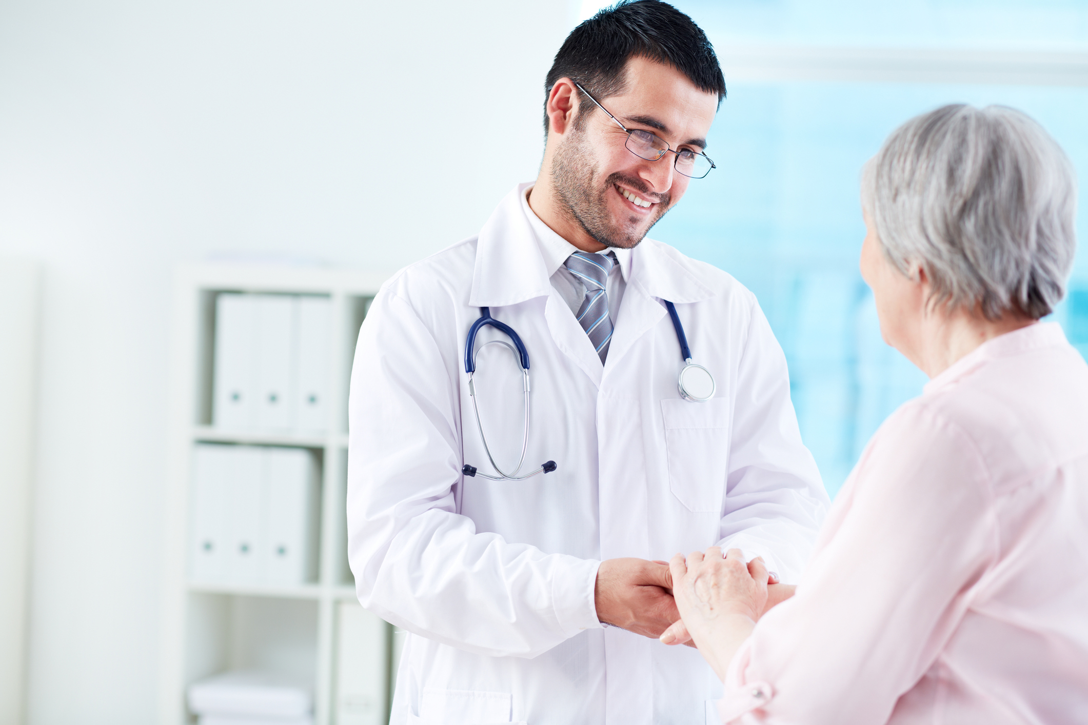 Doctor consulting with senior woman.