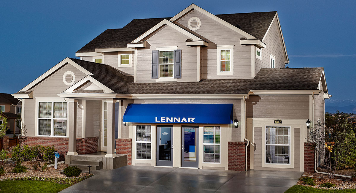 A Lennar sales office lit up at night.