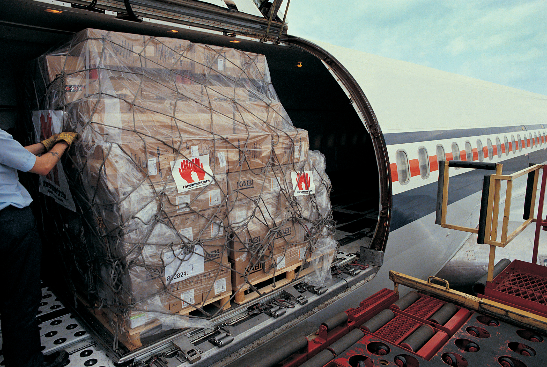 A cargo plane being loaded.