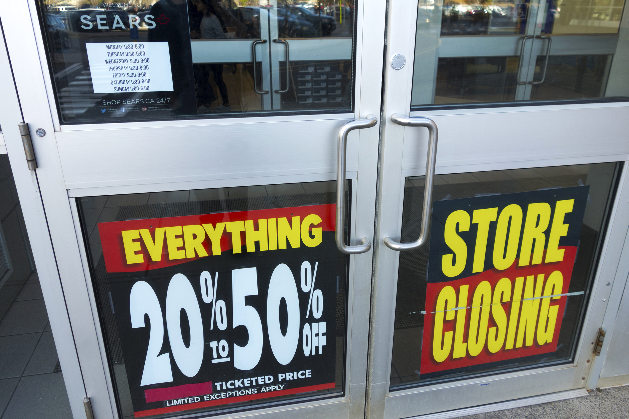 A store has a store closing sign.