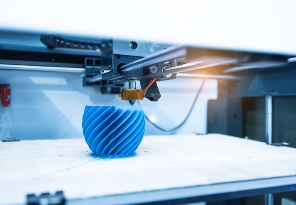 3D printing a machine part. 