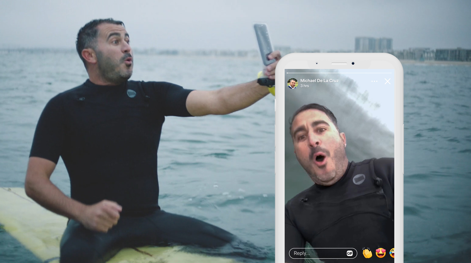 A man on a surfboard taking a video of himself with his smartphone. Screenshot of the video on a smartphone.