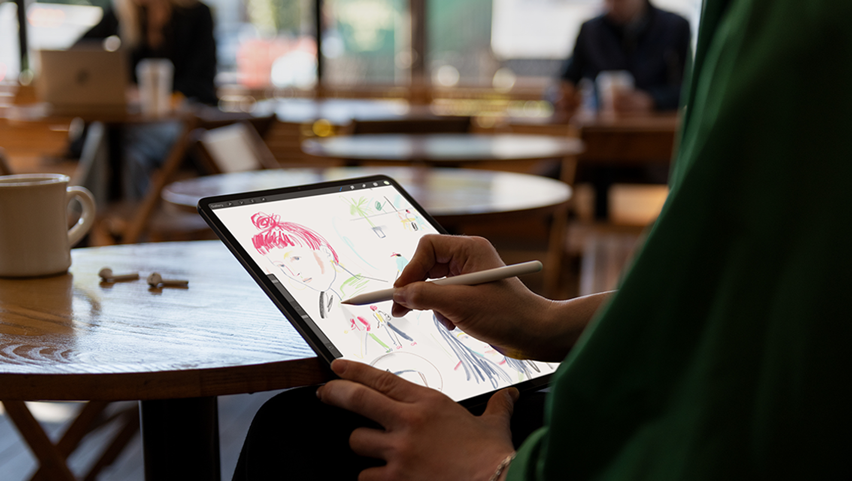Person drawing on iPad Pro with Apple Pencil