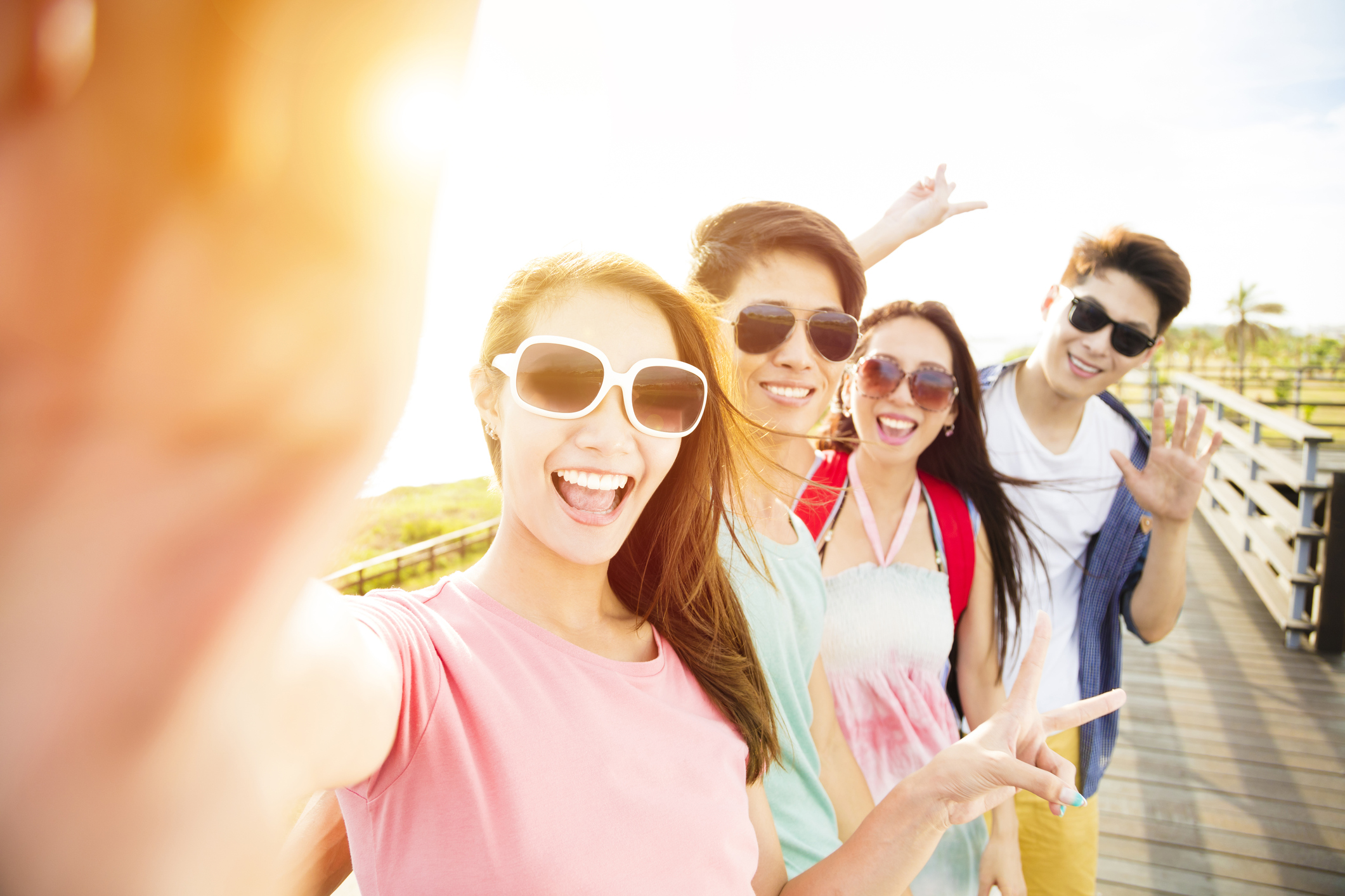 A group of young people take a selfie.