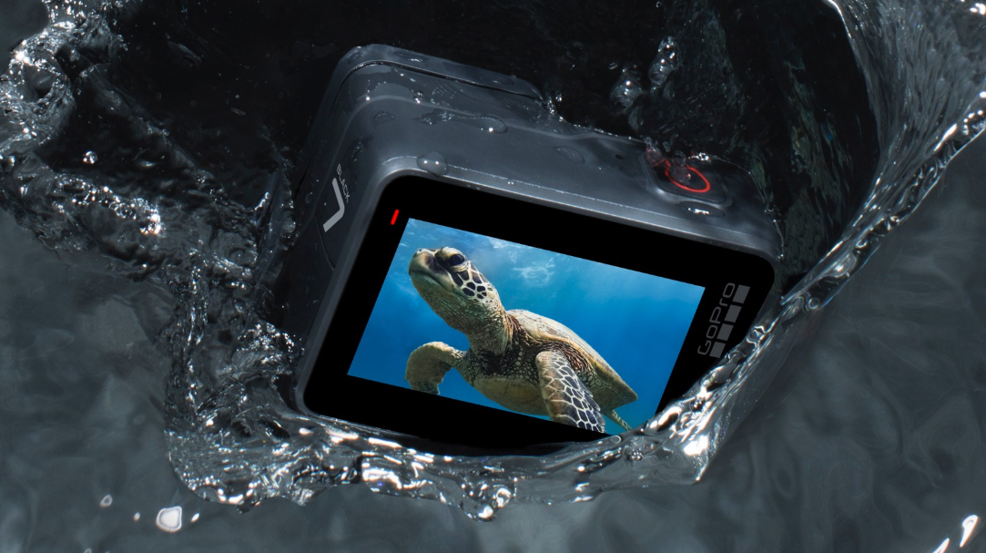 GoPro Hero 7 camera splashing on water.