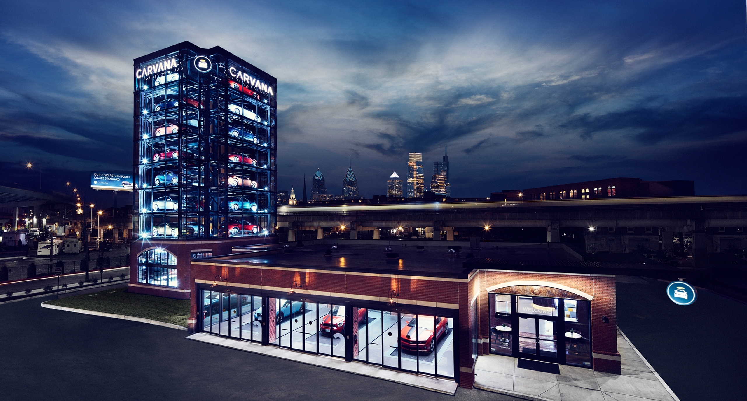 Night view of Carvana's nine-story automated car vending machine.