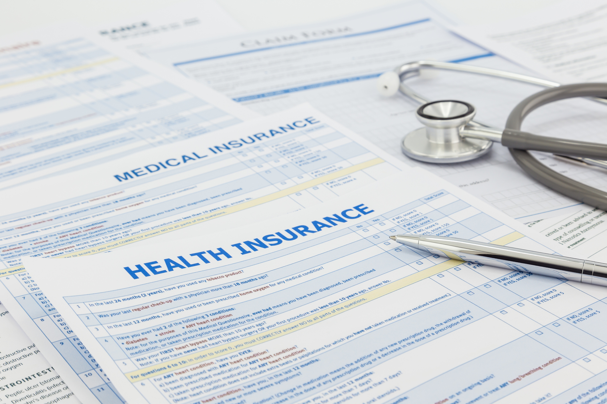 Health insurance papers spread out on a desk