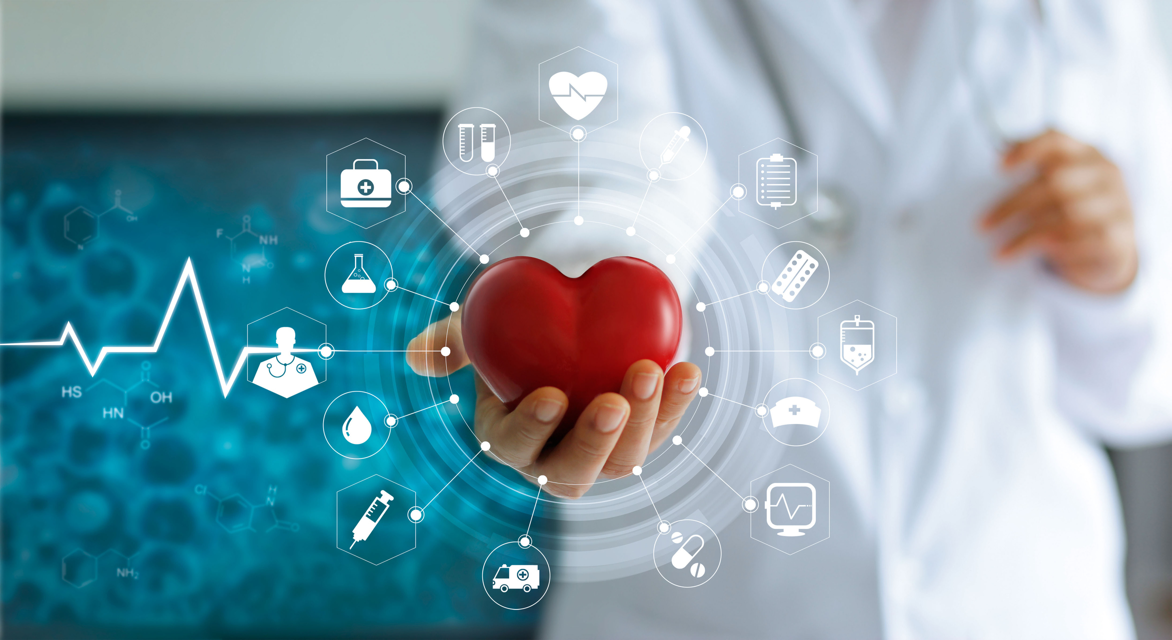 A doctor holding a red heart shape out in one hand.