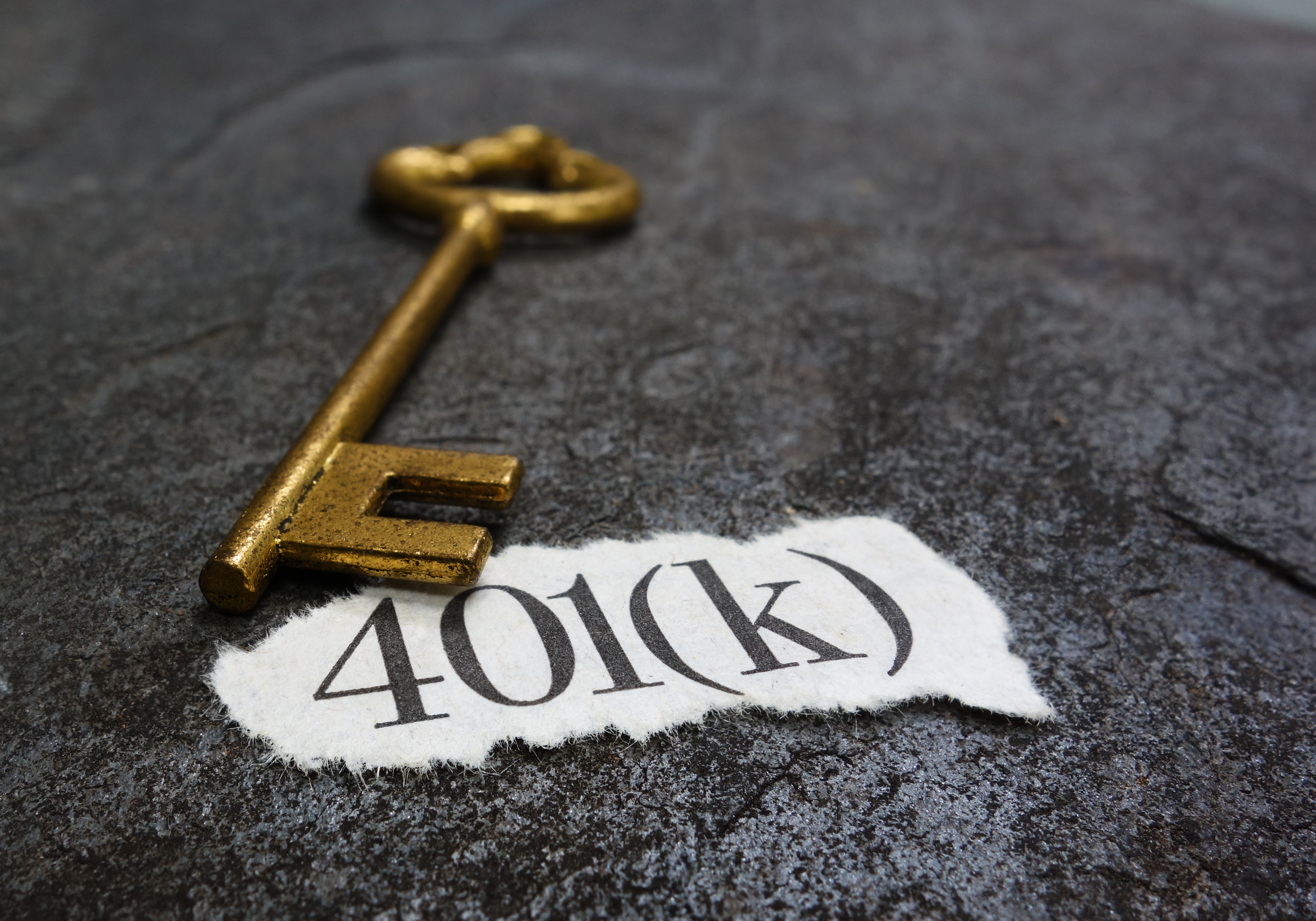 key and a paper that says 401(k)