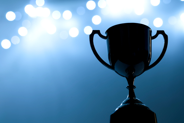 Trophy in the dark with blue abstract background.