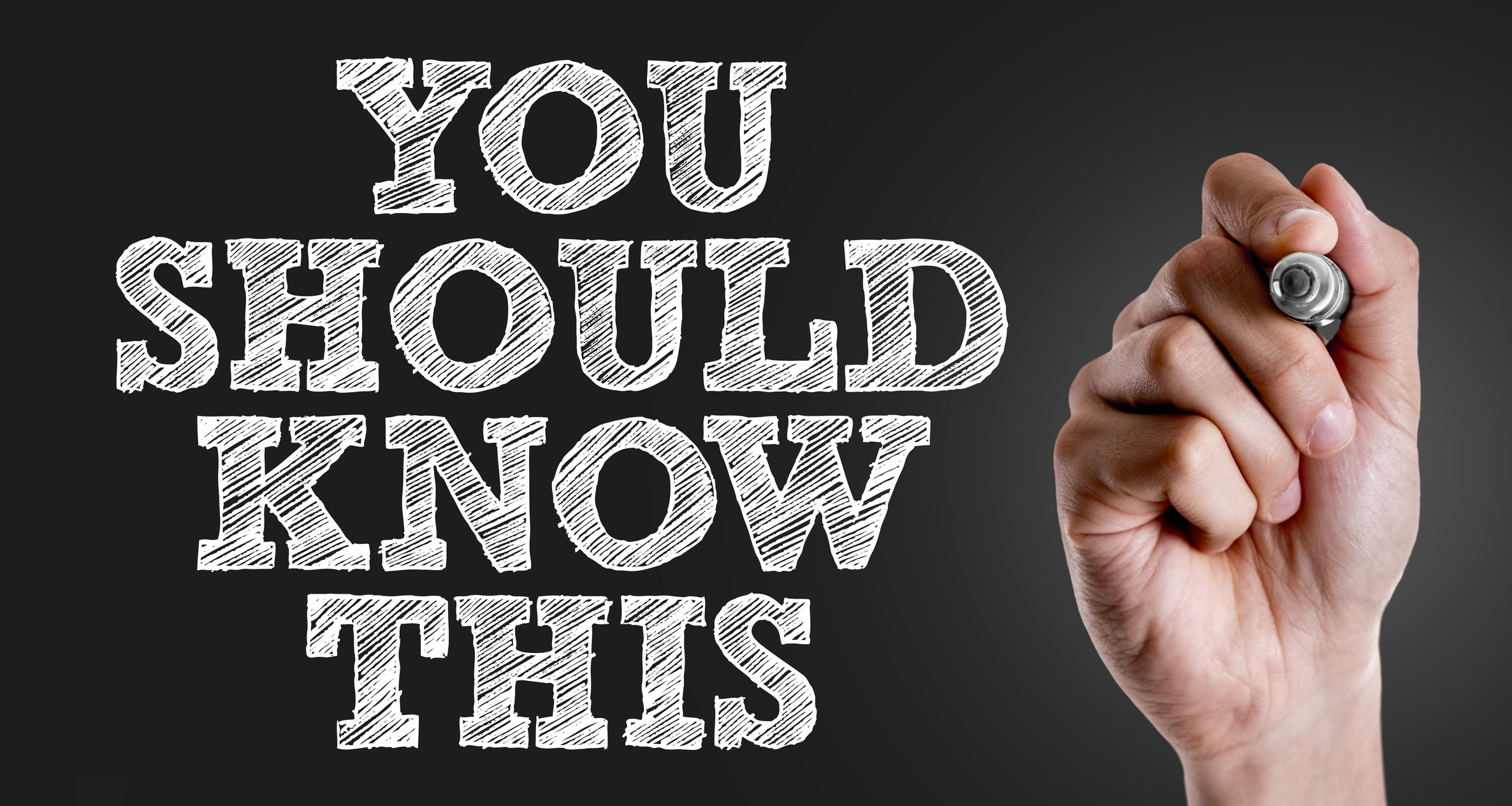 A hand has just written you should know this in block letters on a transparent board.