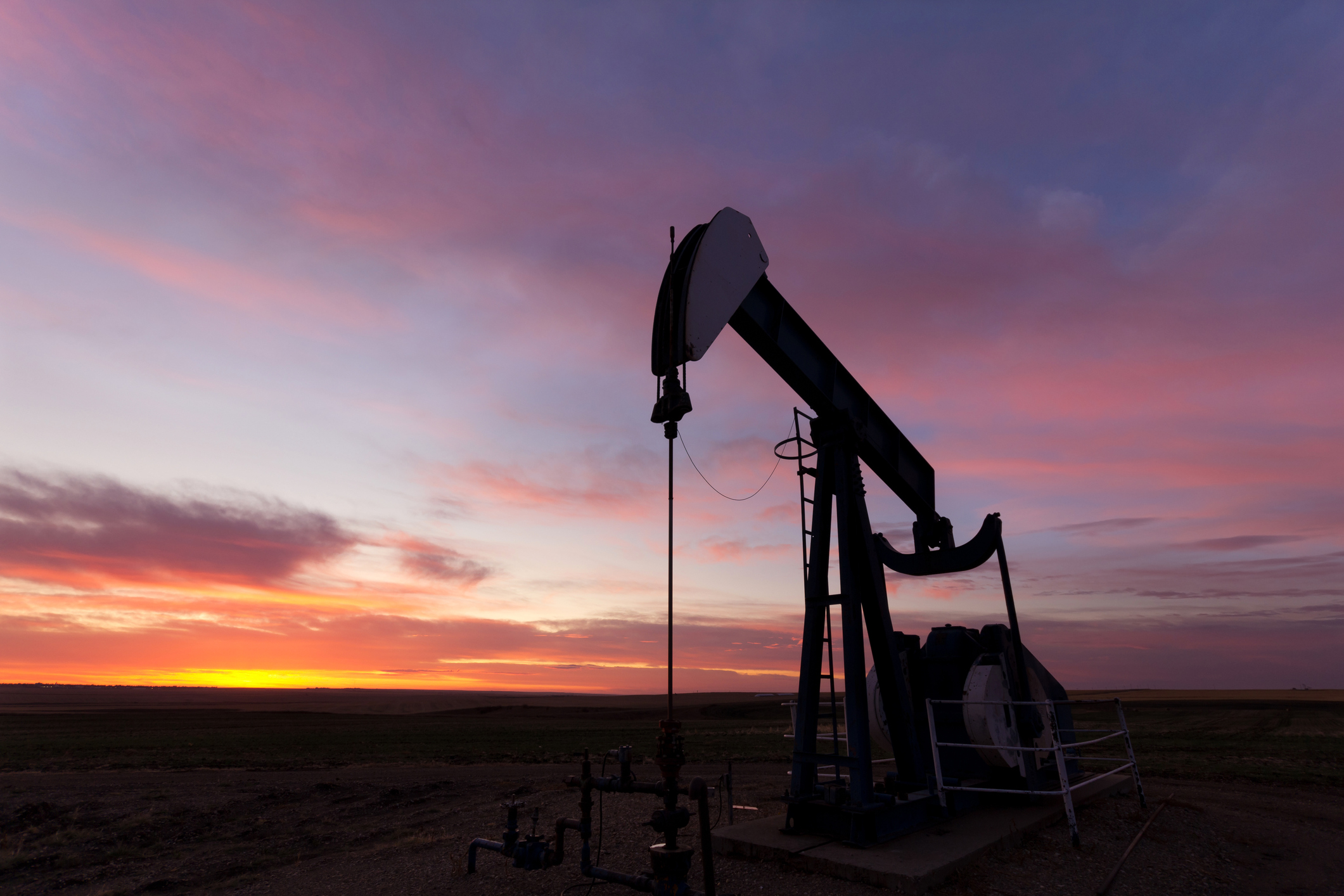 An oil pump at dusk.