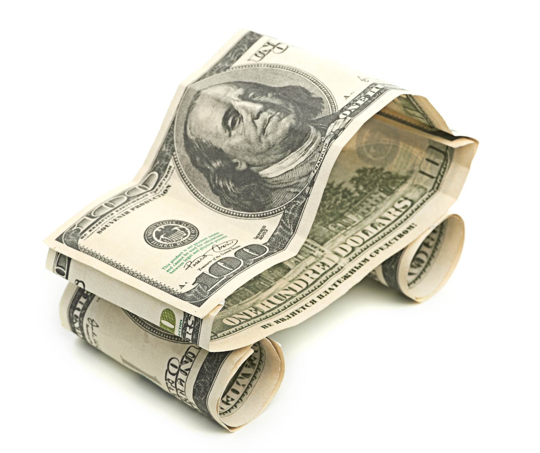 Three hundred-dollar bills folded into a simple car.