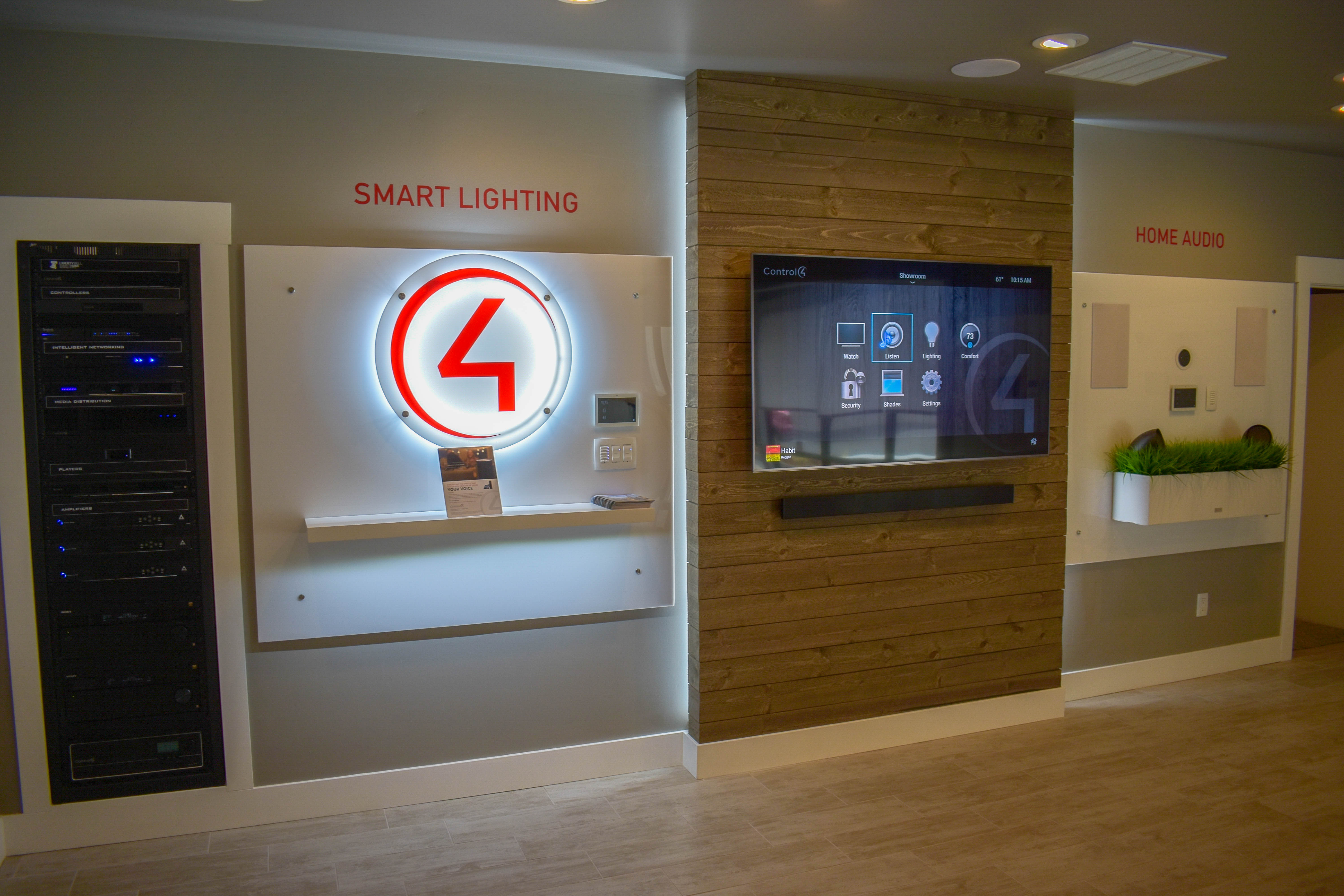 Interior of a Control4 showroom with wall mounted demonstrations.