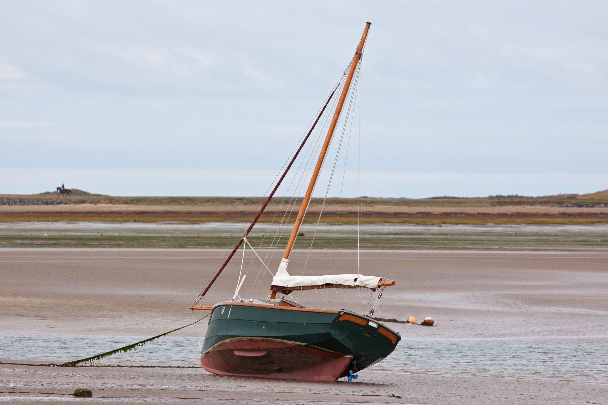 Sailboat beached by ebb tide.