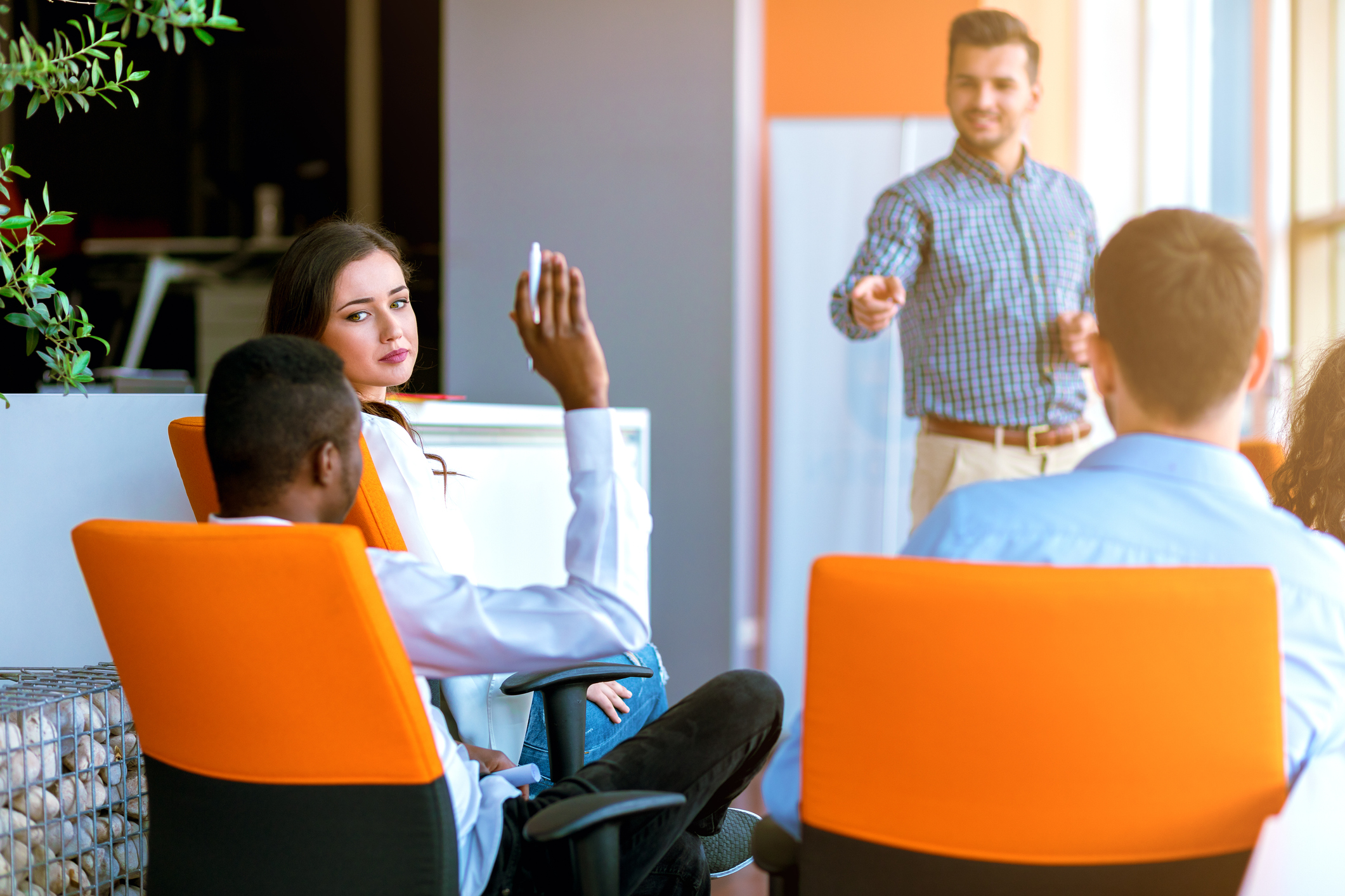 Corporate training class in contemporary office setting.