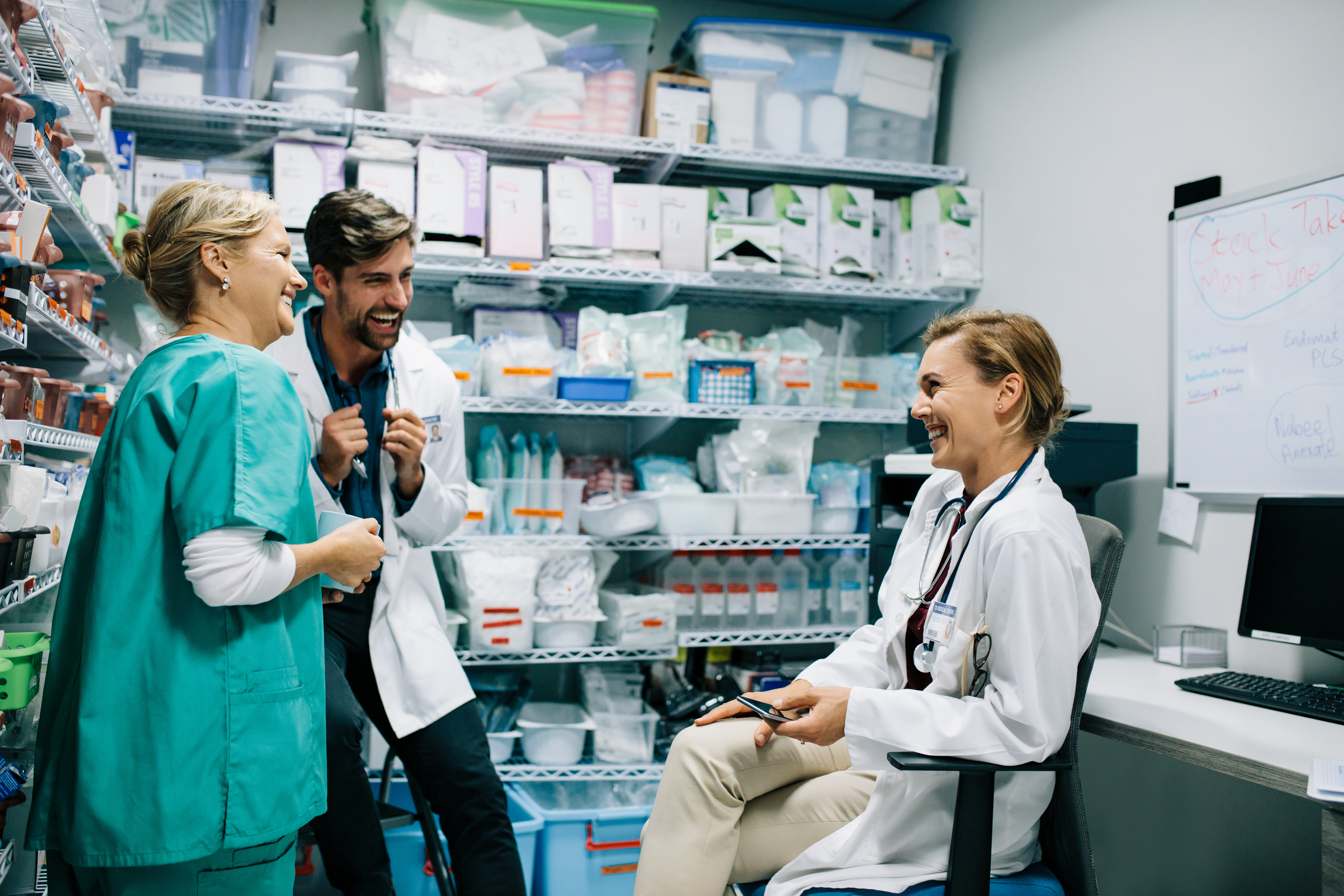 Healthcare providers hanging out in the pharmacy.