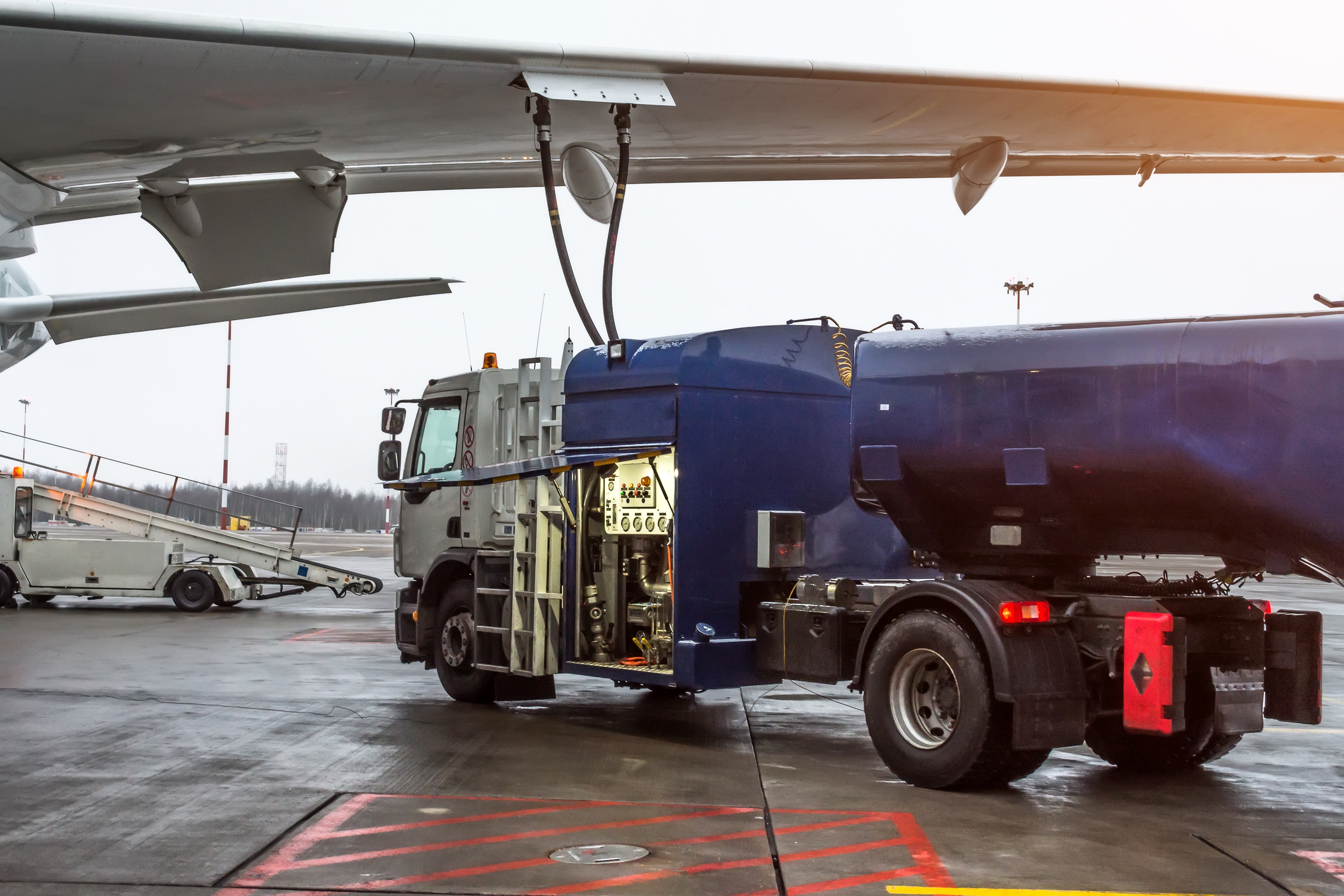Tanker truck fueling an airplane