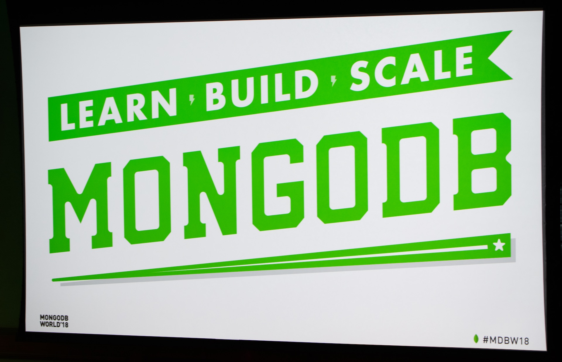 Green logo and slogan for MongoDB.