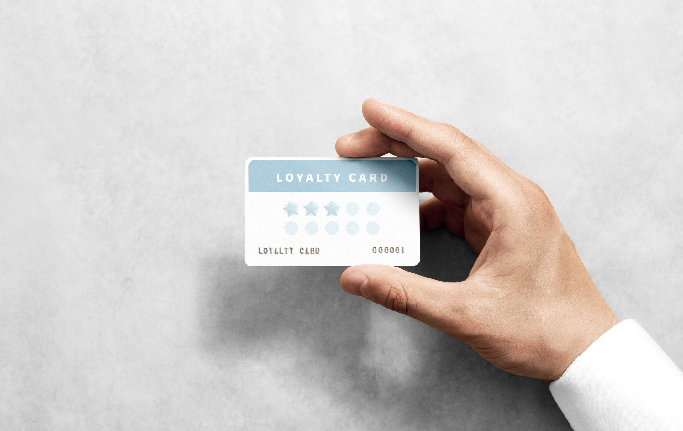 A person holds up a card.