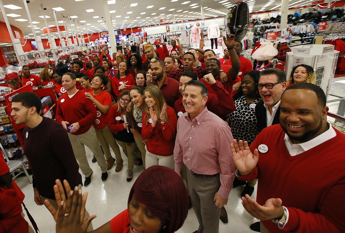 Dozens of workers at a Target store wearing uniforms.