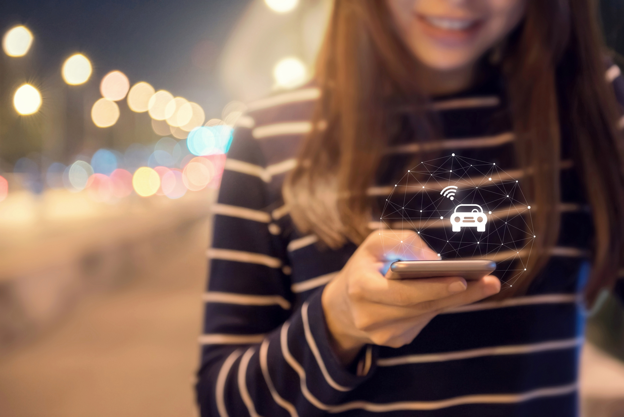 Woman ordering a ride from her smart phone
