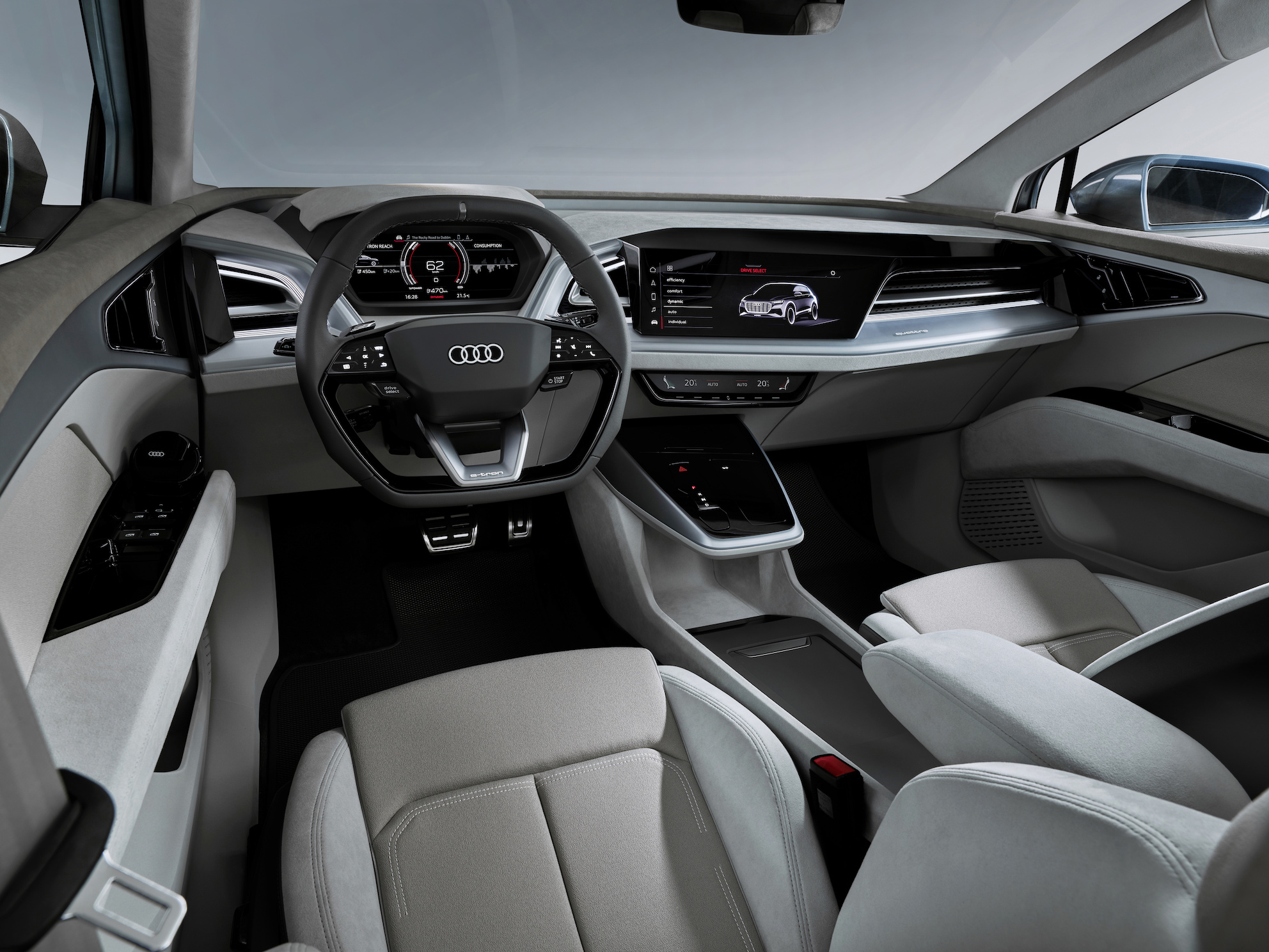 A view of the front seats and dashboard of the Audi e-tron Q4 Concept, showing high-quality materials and sleek design.
