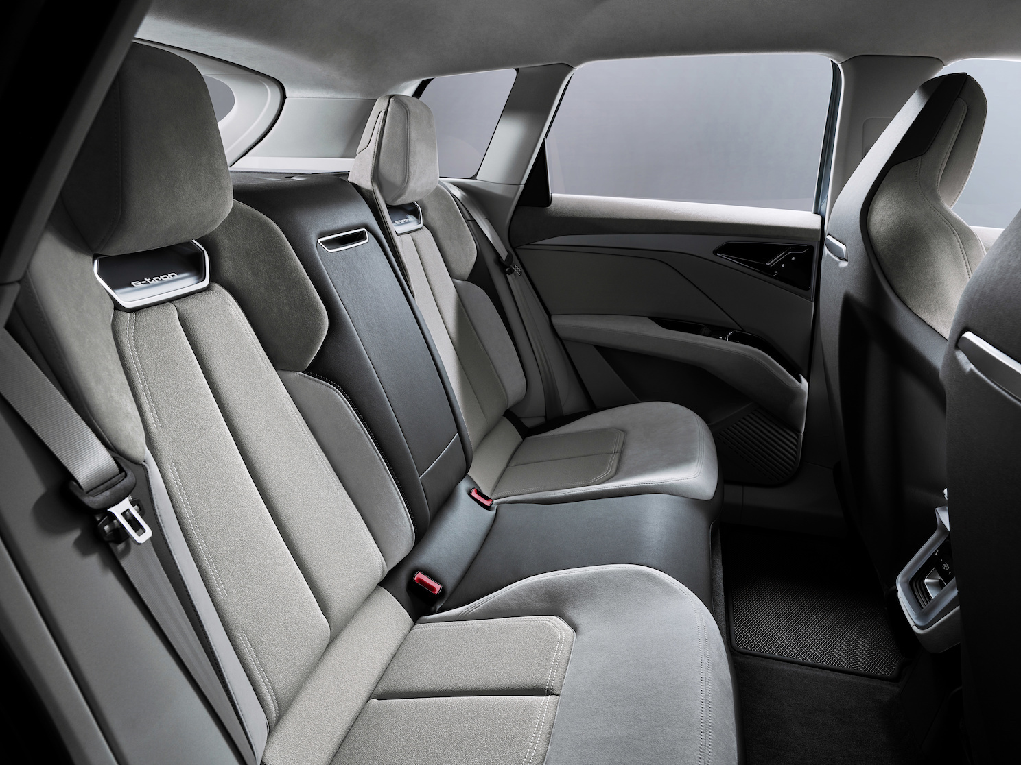 A view of the rear seats of the e-tron Q4 Concept, showing ample leg and headroom for adult passengers.