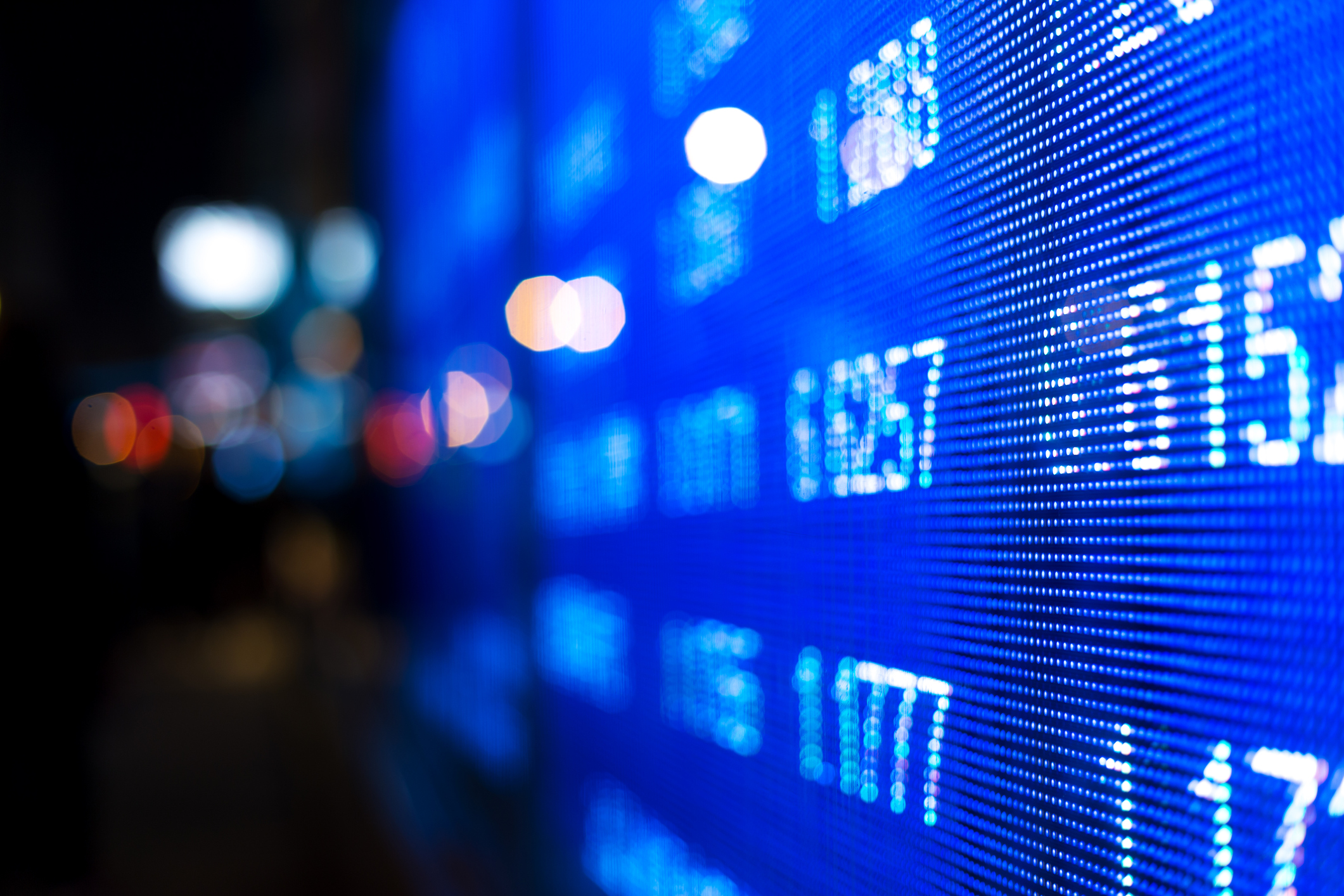 Stock market data on a digital screen.