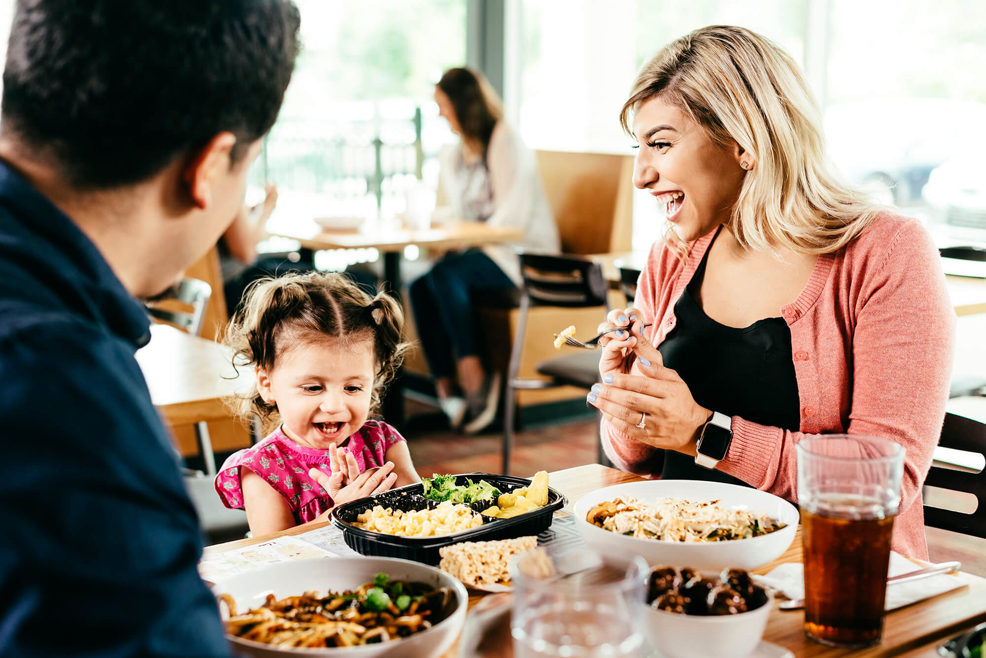 A family eating at Noodles & Company.