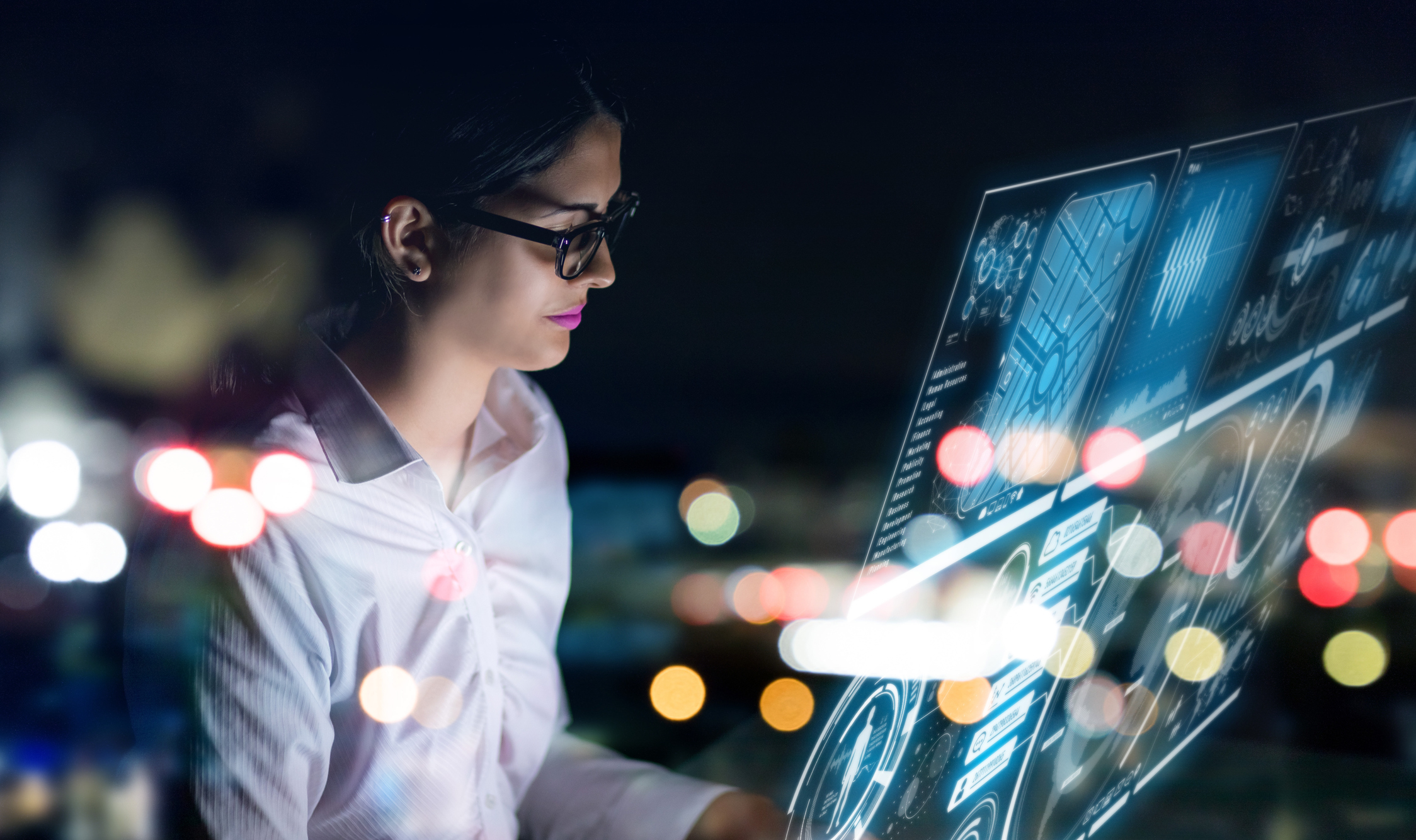 A woman examines business data.