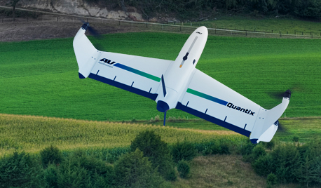 Quantix Drone flying over green pastures