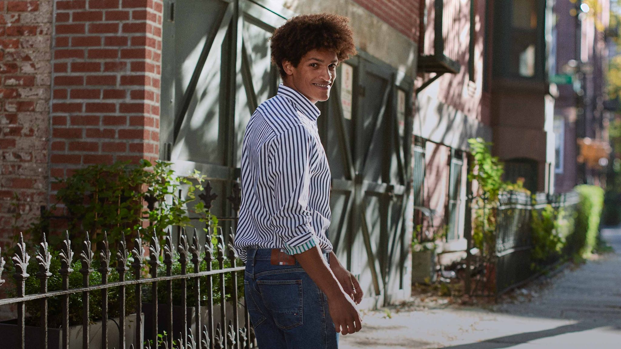 A man wearing Tommy Hilfiger apparel.