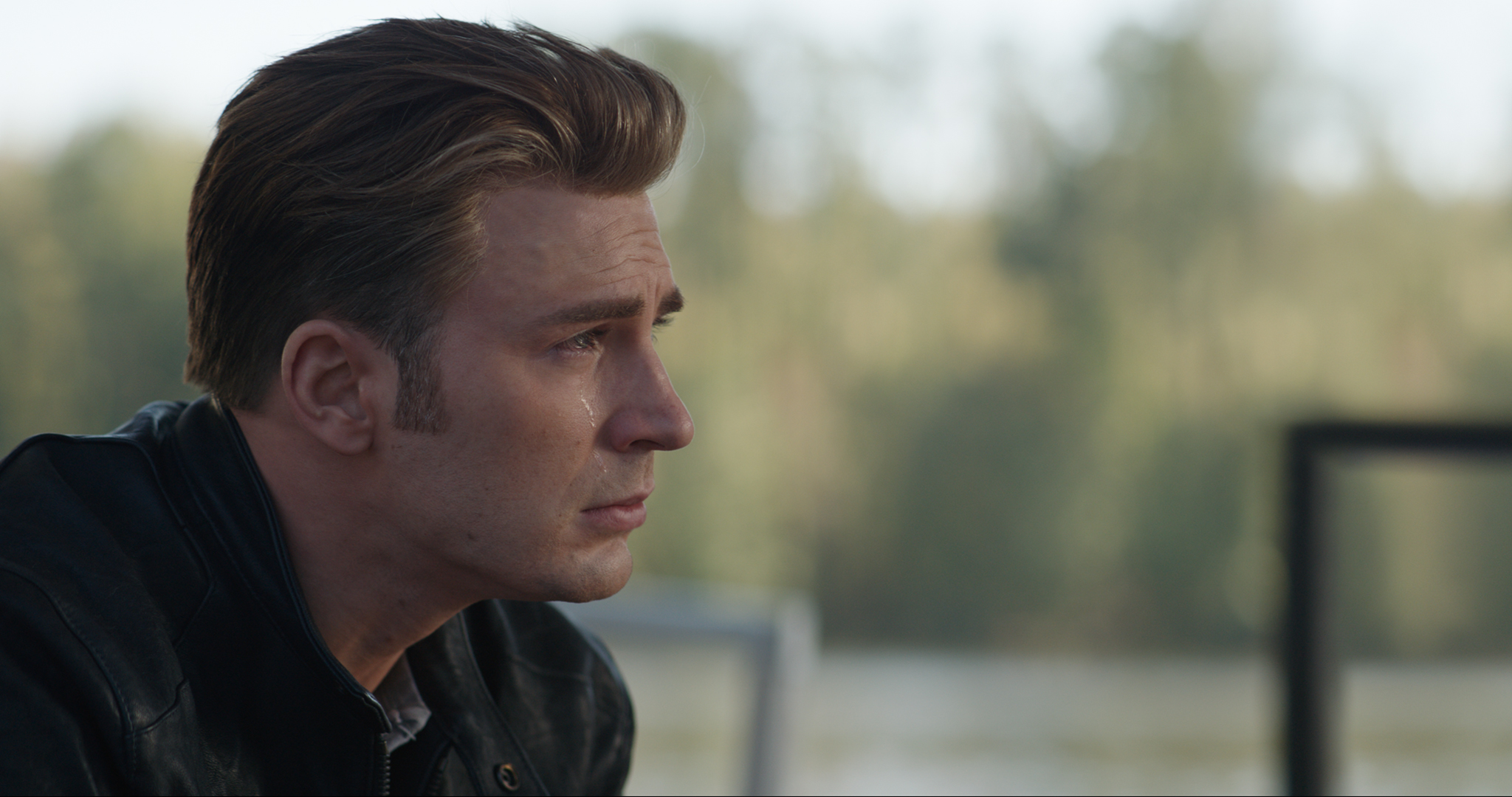 Chris Evans as Captain America with a tear rolling down his cheek in a scene from Avengers: Endgame.