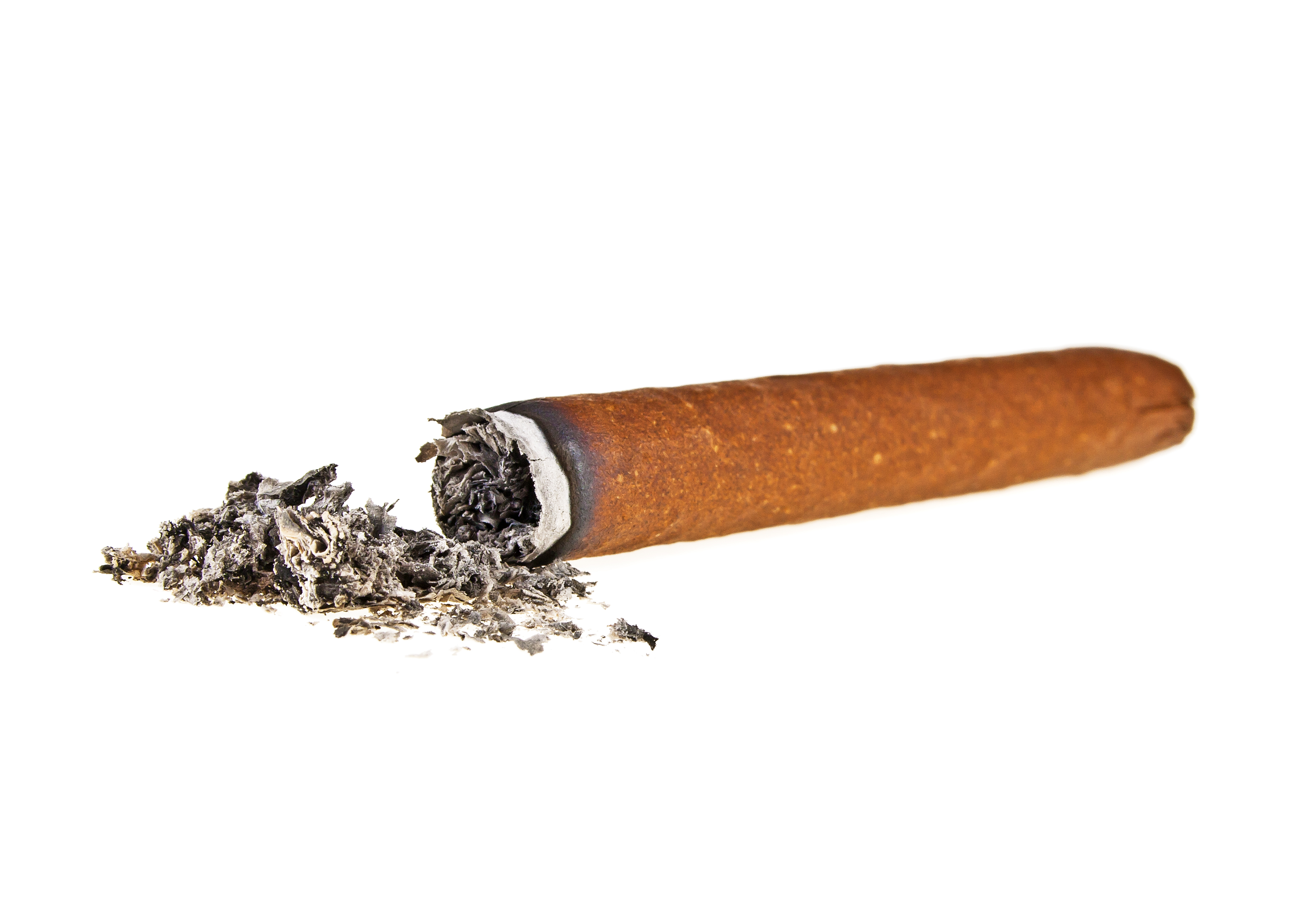 A lit cigar lying next to its ash