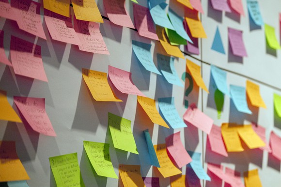 Sticky notes on a board. 
