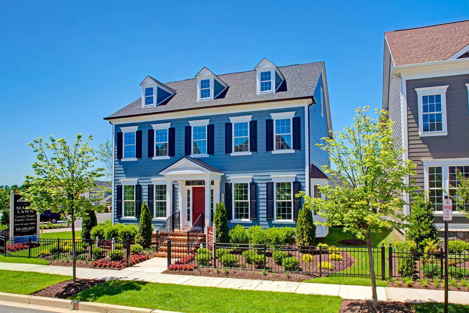 A two-story, pristine-looking house.