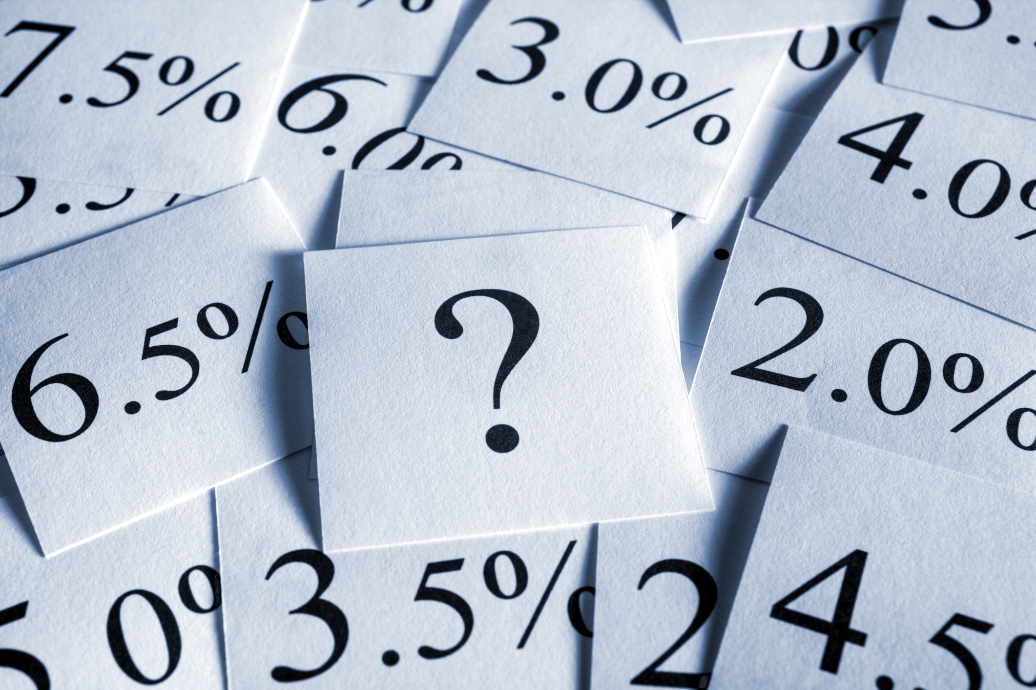 Various interest rates on squares of paper.